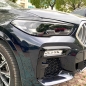 Preview: Scheinwerferblenden Böser Blick Schwarz Glanz für BMW X5 G05 X6 G06 Montiert